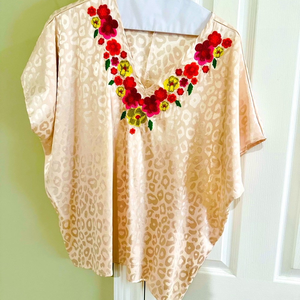 Ladies oversized blouse with embroidered neckline